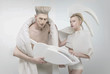 Pale futuristic blonde couple in white outfit