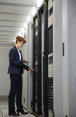Poster - Technician working on servers using tablet pc