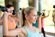 © Syda Productions - group of women with dumbbells in gym