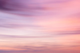 Fototapeta Zachód słońca - Defocused sunset sky background  with blurred panning motion.