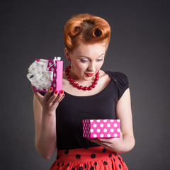 Portrait of a young woman with a gift box