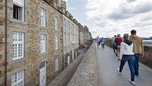 People Walking On The Walls Of Saint Malo, France.