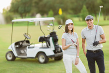 Young Couple At Golf Cart