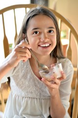 Wall Mural - Hispanic Girl Eats Ice Cream