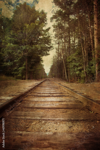 Cuadros en Lienzo Old railroad tracks with vintage texture effect