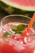 Freshly squeezed watermelon juice with mint and ice cubes