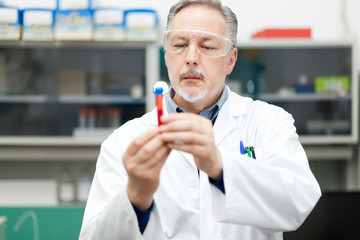 Poster - Male scientist at work in a laboratory