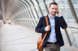 © Production Perig - Young attractive man having a call in a airport hall