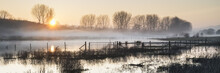 Panorama Landscape Of Lake In Mist With Sun Glow At Sunrise
