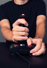 Gamer Playing Video Game With Retro Joystick