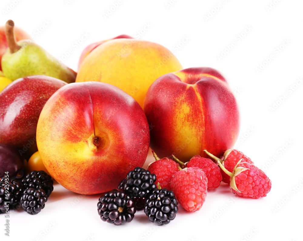 Different berries and fruits isolated on white