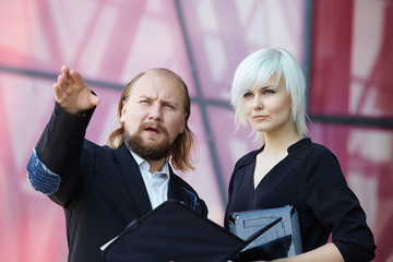 businessman and business woman are discussing