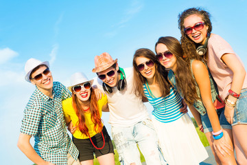 Wall Mural - group of young people wearing sunglasses and hat