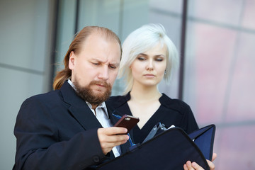 businessman and business woman are discussing