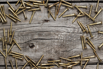 Wall Mural - yellow screws on the wooden table