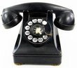 © Todd Henderson - A black antique rotary phone on white background.