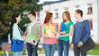 © Syda Productions - group of smiling students standing