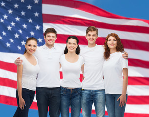 Wall Mural - group of smiling teenagers in white blank t-shirts
