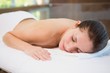 © WavebreakMediaMicro - Beautiful woman lying on massage table at spa center