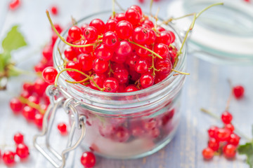 fresh red currant fruit jar wooden table