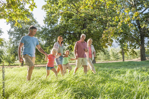 Fotografie, Obraz Multi-Generation Family Enjoying Walk In Beautiful Countryside