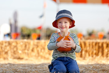 kid at pumpkin patch