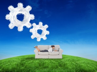 Aufkleber - Composite image of business woman lying on couch