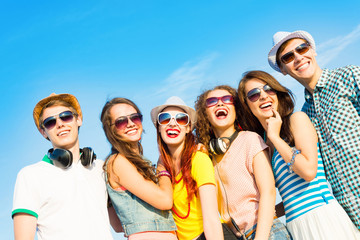 Wall Mural - group of young people wearing sunglasses and hat