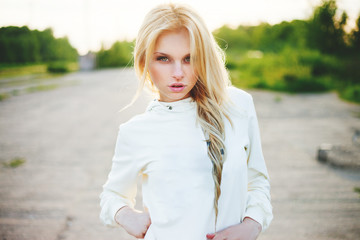 Beautiful girl outdoor in the park looking at you