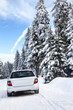 Car driving in winter landscape