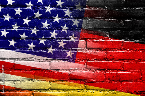Fotografija USA and Germany Flag painted on brick wall