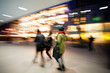 © FotoKachna - Young women walking down shopping street at dusk