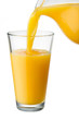 Orange juice is poured from pitcher into the glass