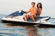 © Nejron Photo - Multi ethnic couple sitting on a jet ski