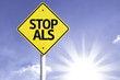 © gustavofrazao - Stop ALS road sign with sun background