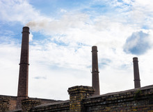 Three Smoke Stacks Of The Industrial Plant
