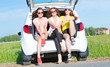 © adam121 - young attractive woman sitting in the open trunk