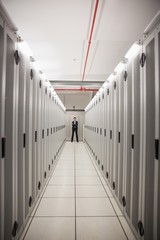 Aufkleber - Serious technician standing in server hallway