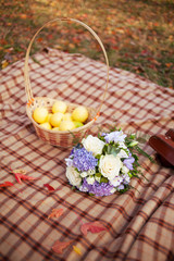 Wedding flowers bouquet  and basket of yellow organic apples and