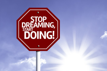 Wall Mural - Stop Dreaming, Start Doing! red sign with sun background