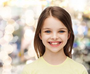 Poster - smiling little girl over white background