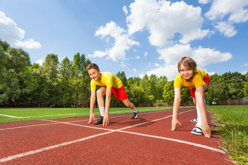 Two boys in ready position to run marathon