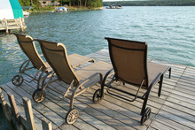 Lounge Chairs On A Lake Front Dock