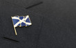 Scotland flag lapel pin on the collar of a business suit