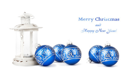 Blue Christmas balls and vintage lantern isolated on white backg