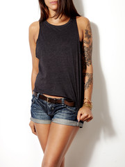 Wall Mural - young tattooed woman wearing blank sleeveless t-shirt