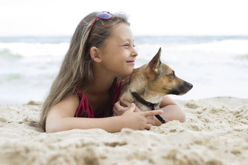 Canvas Print - Child and puppy on the sea