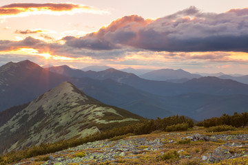 Wall Mural - panorama of mountains - sunset time. beautiful peaks, clouds an