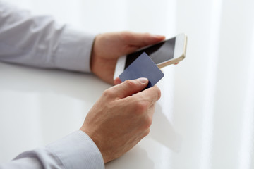 Wall Mural - male hands holding credit card