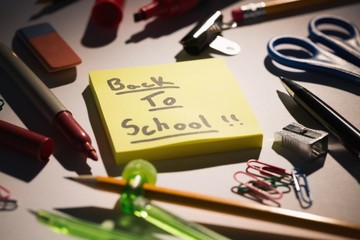 Poster - Students table with school supplies